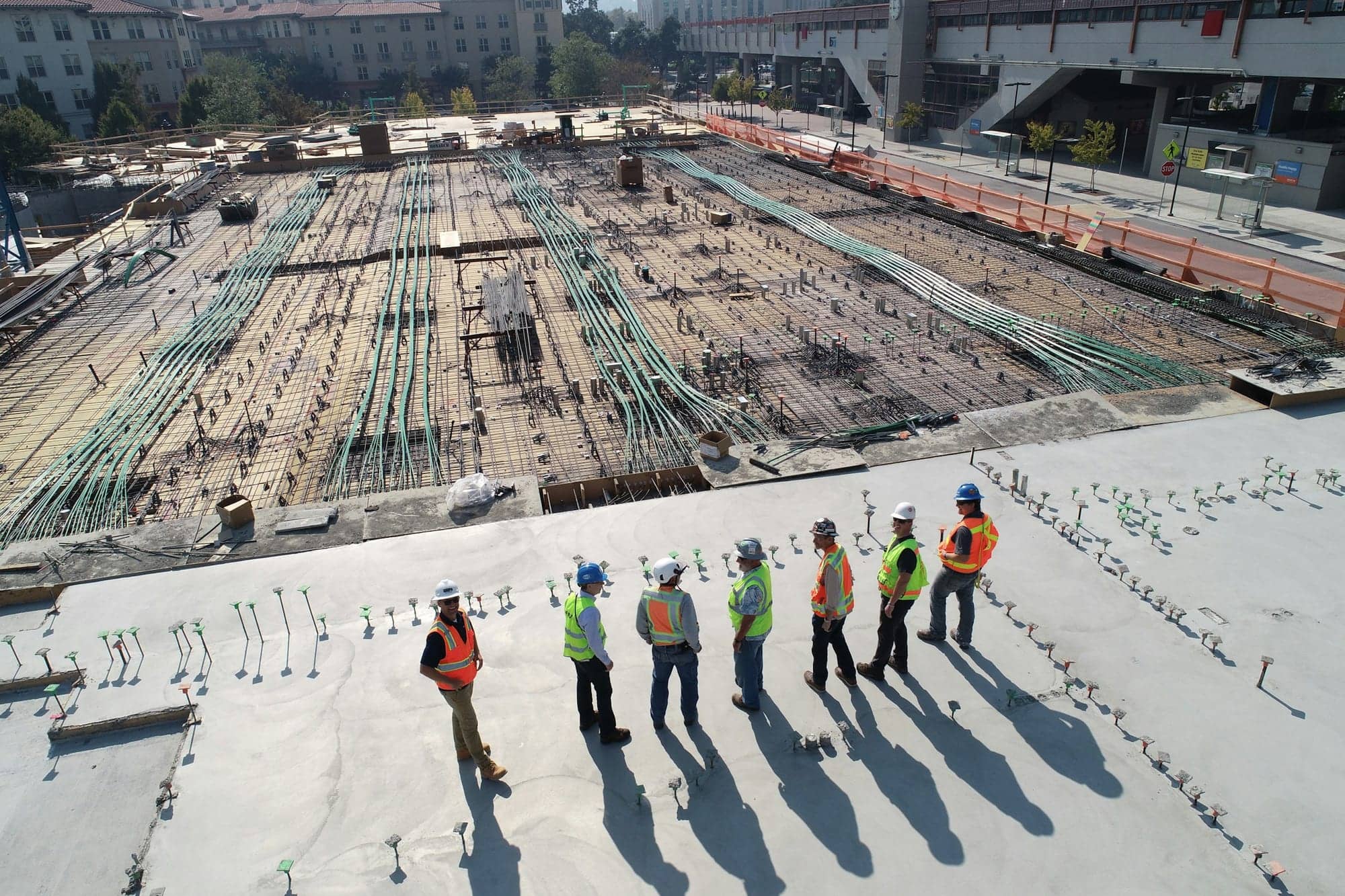 Engineers walking an active foundation site from above