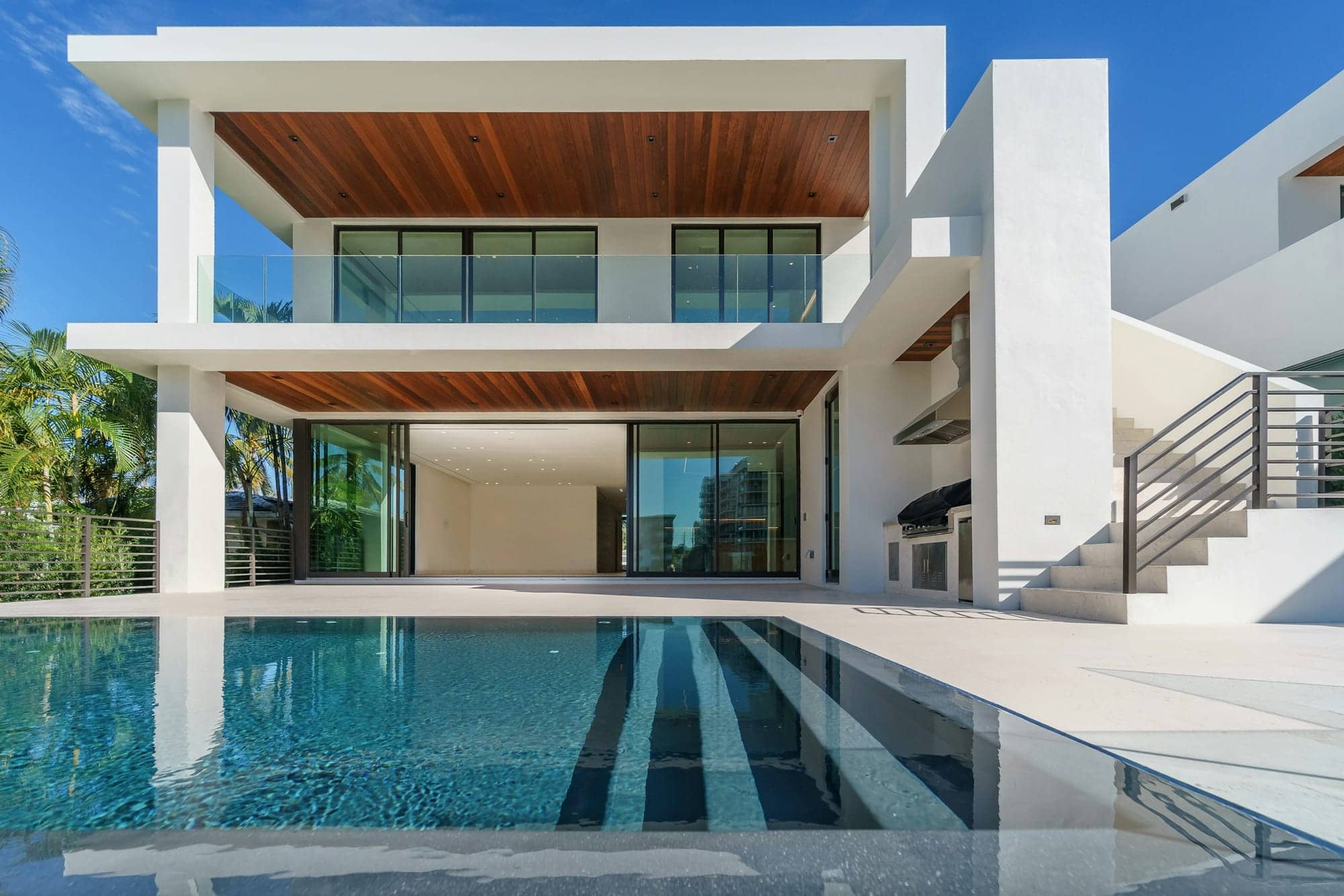 Contemporary villa with infinity pool at dusk