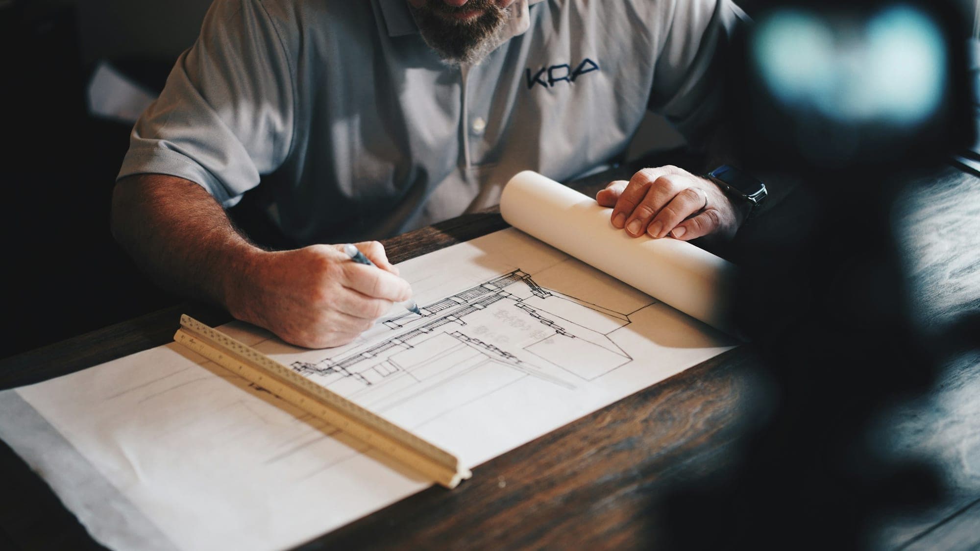 Architect annotating construction drawings